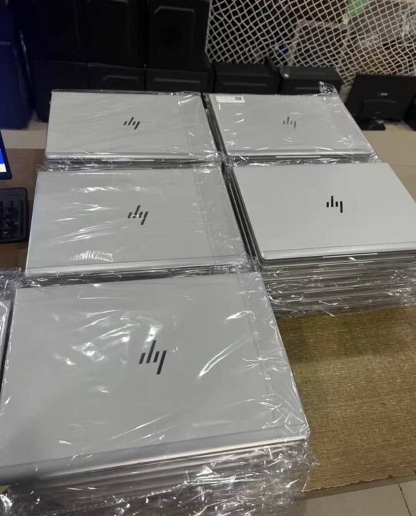 a group of laptops wrapped in plastic
