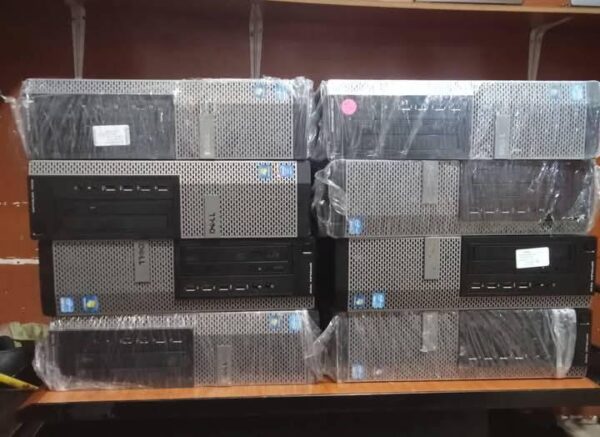 a stack of computer equipment wrapped in plastic